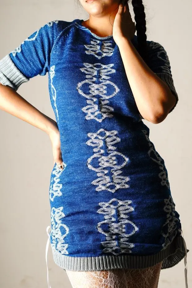 Close view of the dress with a hand on the hip